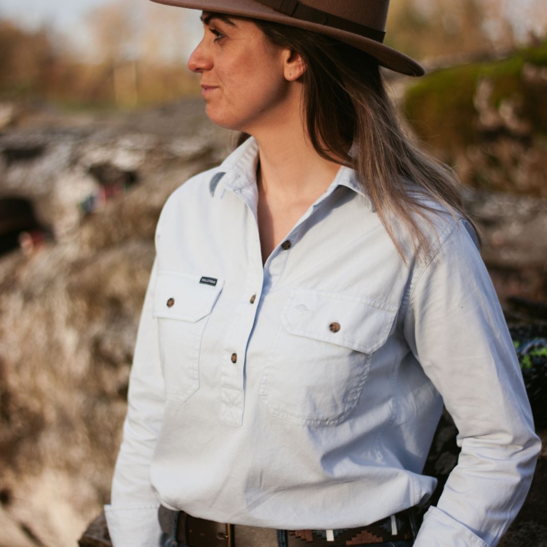 Model wearing Ballybar Irish Fedora Hat in countryside setting
